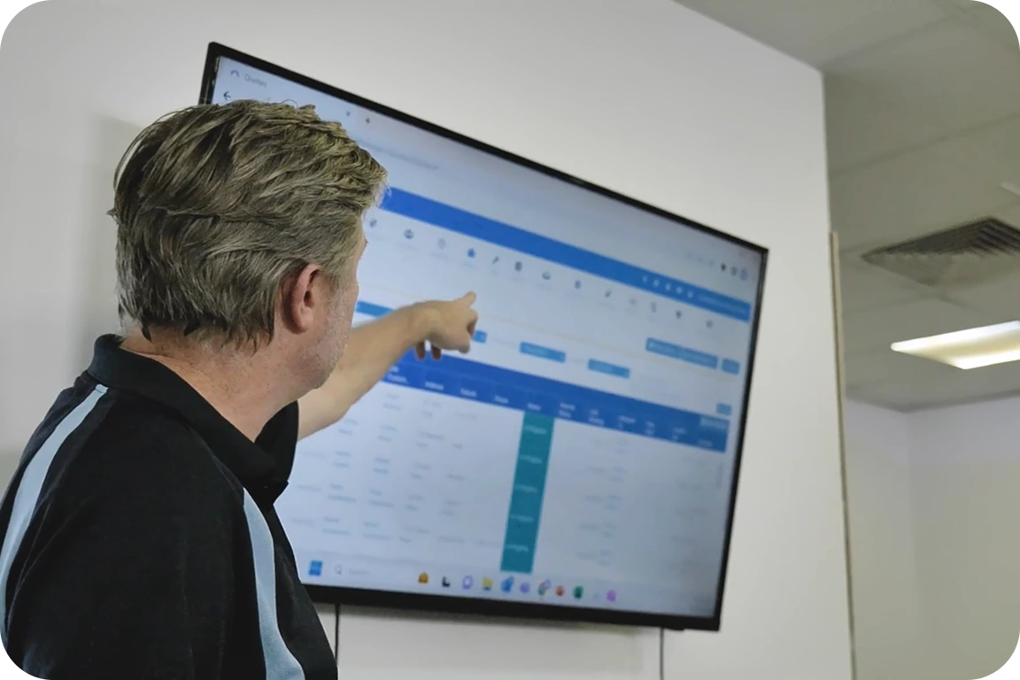 Image featuring a tradie fixing a door